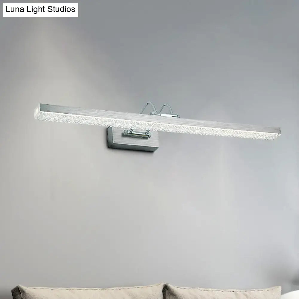Silver rectangular modernist wall light with textured crystal diffuser and sleek metallic bracket for bedroom vanity use