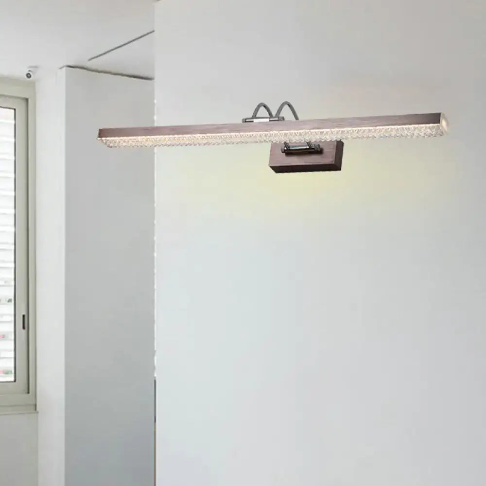 Modernist wall light with sleek metallic finish and embedded crystal accents designed as a bedroom vanity sconce