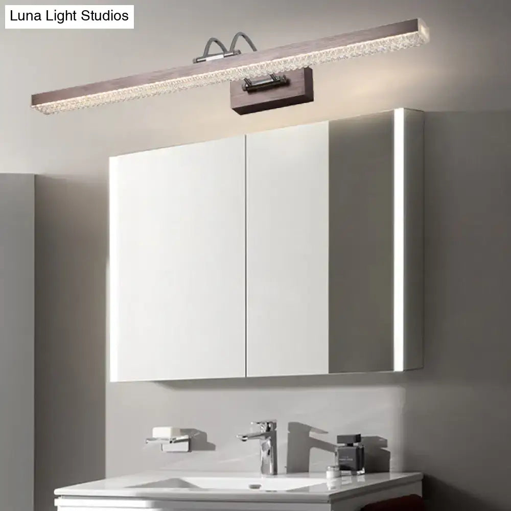 Modernist wall light with a sleek metallic frame and crystal led detail providing warm ambient lighting for bedroom vanity