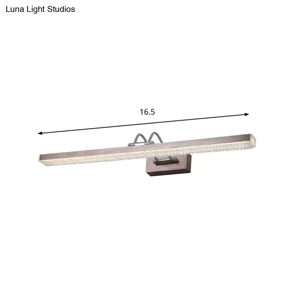 Modernist wall light featuring a brushed nickel LED vanity light with textured glass panel and sleek rectangular design