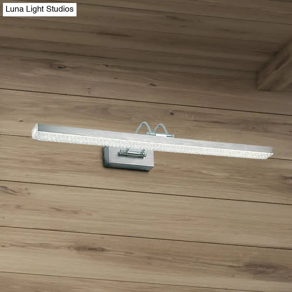 Silver rectangular modernist wall light with textured frosted glass diffuser and metal bracket for bedroom vanity use
