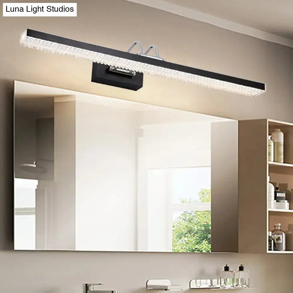 Modernist wall light with sleek black and clear crystal led details in a rectangular design for bedroom vanity use