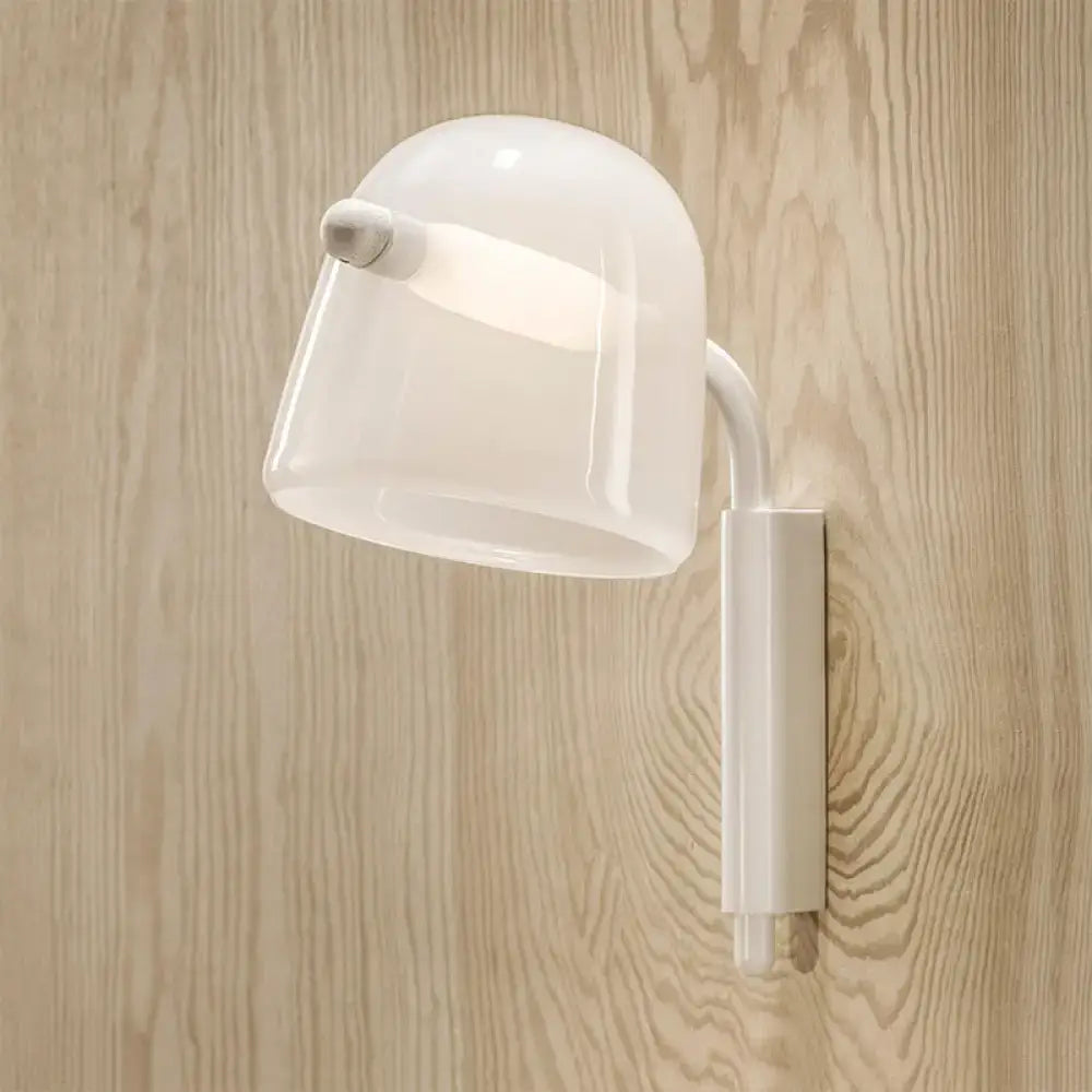 Modernist white black wall lamp with curved dome ceramic shade and sleek cylindrical base for living room sconce