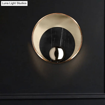 Modernist white black led sconce lighting with a polished brass ring and round marble disc for bedroom wall mirror