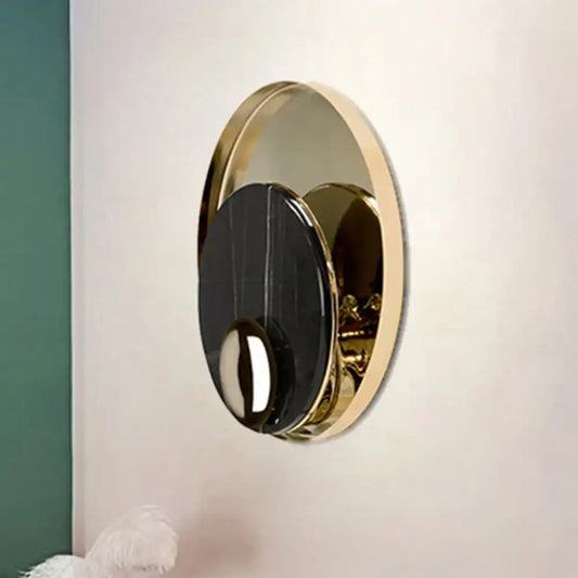 Modernist white black led sconce lighting bedroom wall mirror with oval gold frame and central black glossy disc
