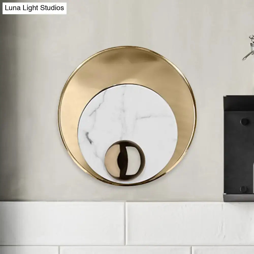 Modernist white black led sconce lighting with gold-toned round marble wall sconce and polished metallic sphere base