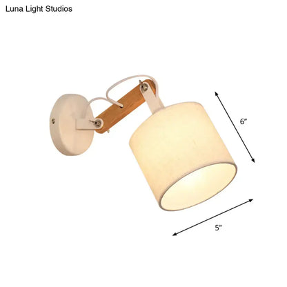Cream-colored cylindrical fabric wall lamp with adjustable wood arm and white mounting plate for 220v-240v 110v-120v use