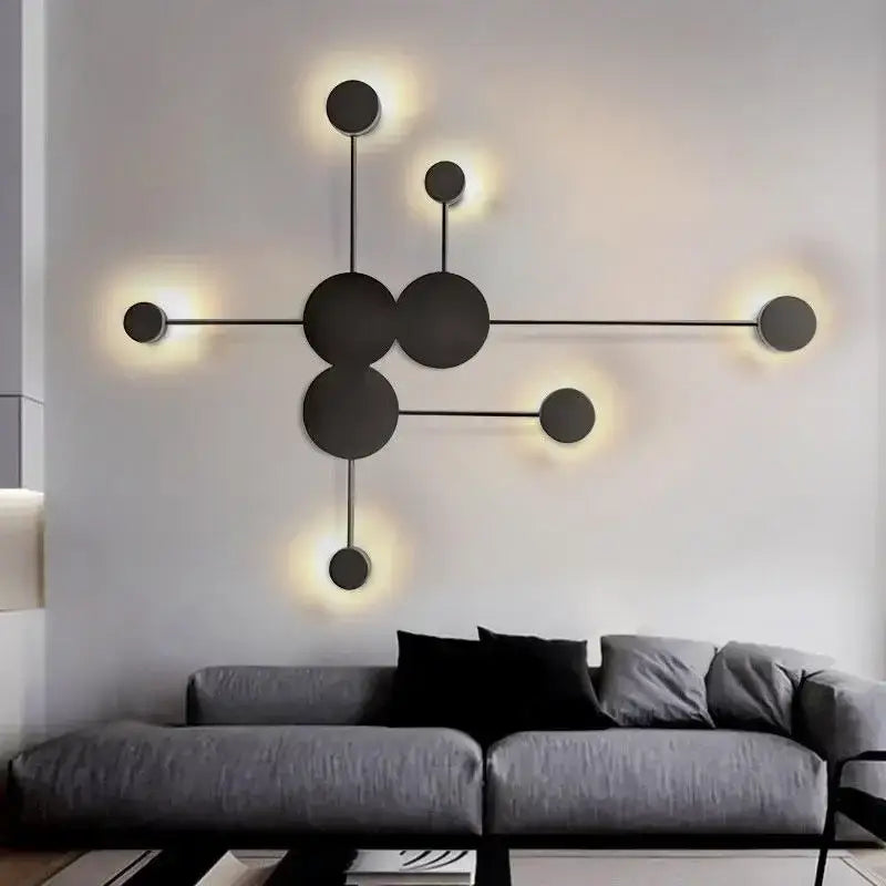 Modern black wall lamp from decorbites creative line with circular elements and warm ambient glow for living room