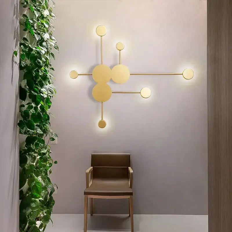 Modern gold-toned wall lamp with geometric interconnected circles from decorbites creative line rgb for living room decor
