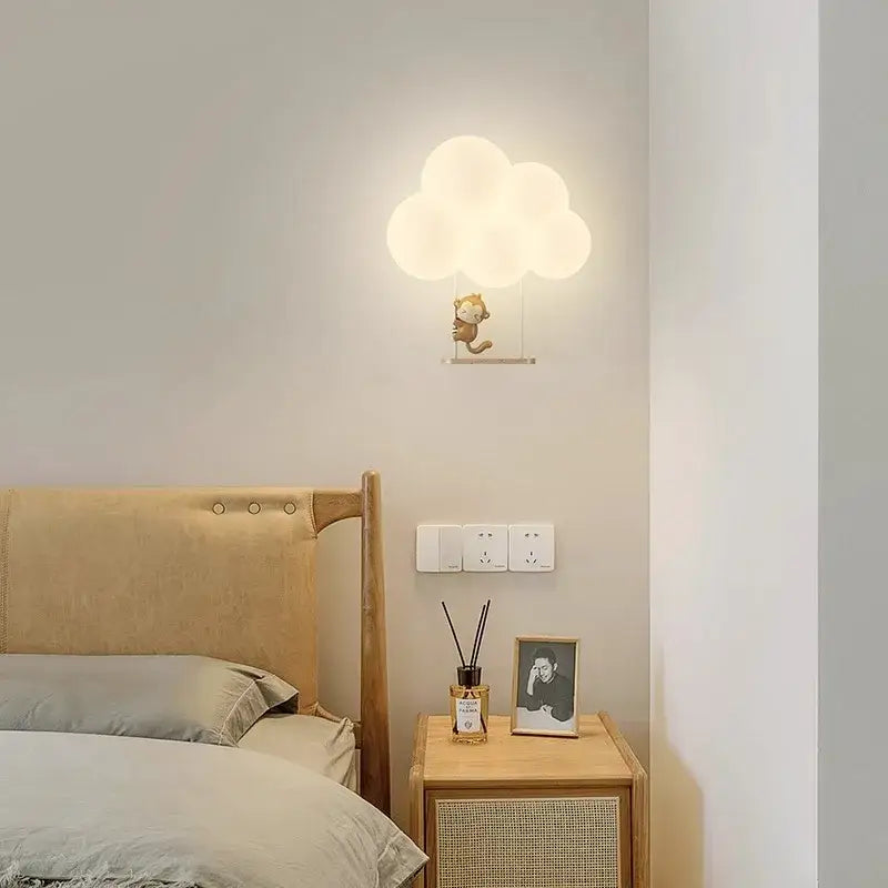 Monkey decorbites cloud cartoon wall lamp featuring a soft white cloud shape and a small monkey figurine for nursery