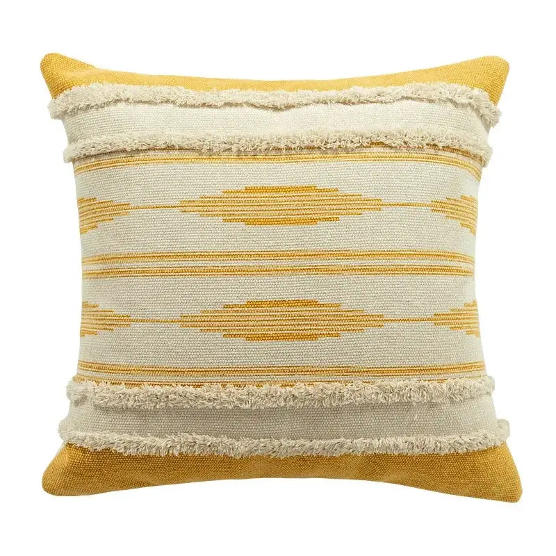 Moroccan geometric cream and mustard cushion cover set featuring a woven mustard yellow and off-white patterned throw pillow with frayed edges