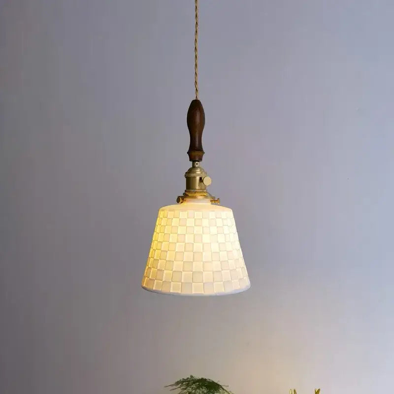 A warm cream-colored mosaic glass pendant light with dark wood handle and brass hardware for ceramic copper led decorbites