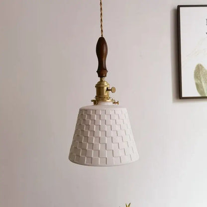 White ceramic pendant light with woven texture brass hardware and dark wood handle in decorbites ceramic copper led style
