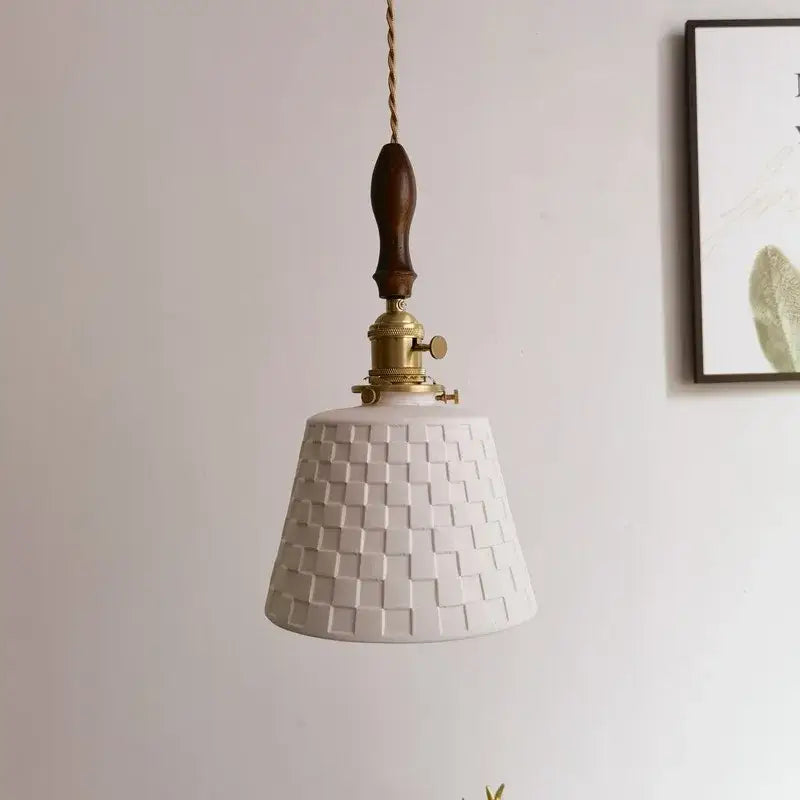 White ceramic pendant light with woven texture brass hardware and dark wood handle in decorbites ceramic copper led style