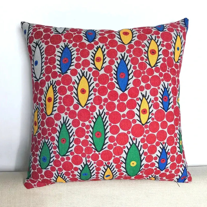 A vibrant red decorbites cotton pumpkin pillowcase with colorful eye patterns for living room decor
