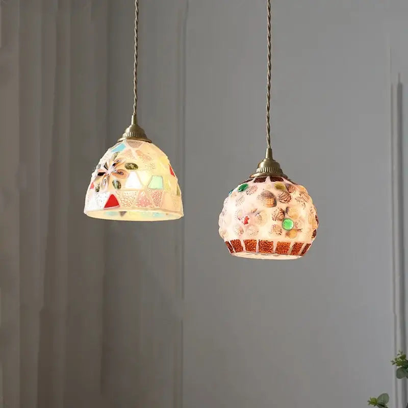 Two ornate pendant lights featuring mosaic pastel floral glass and decorbites conch glass led accents for dining room decor