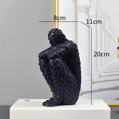 Black mosaic textured figurine of a seated golden man thinker 20cm tall abstract statue for living room decor