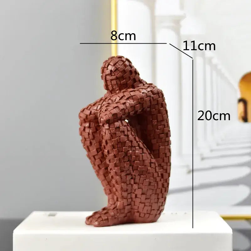 Brown woven resin sculpture of a seated golden man thinker figure 20cm tall for living room decor
