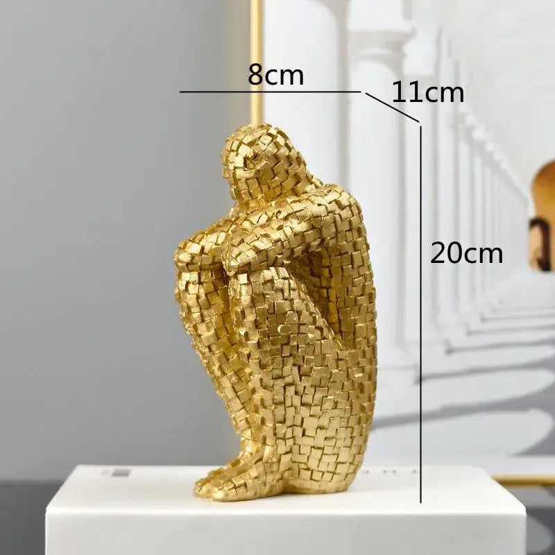 Golden man thinker mosaic statue of a seated human form made of interlocking golden square tiles for living room decor