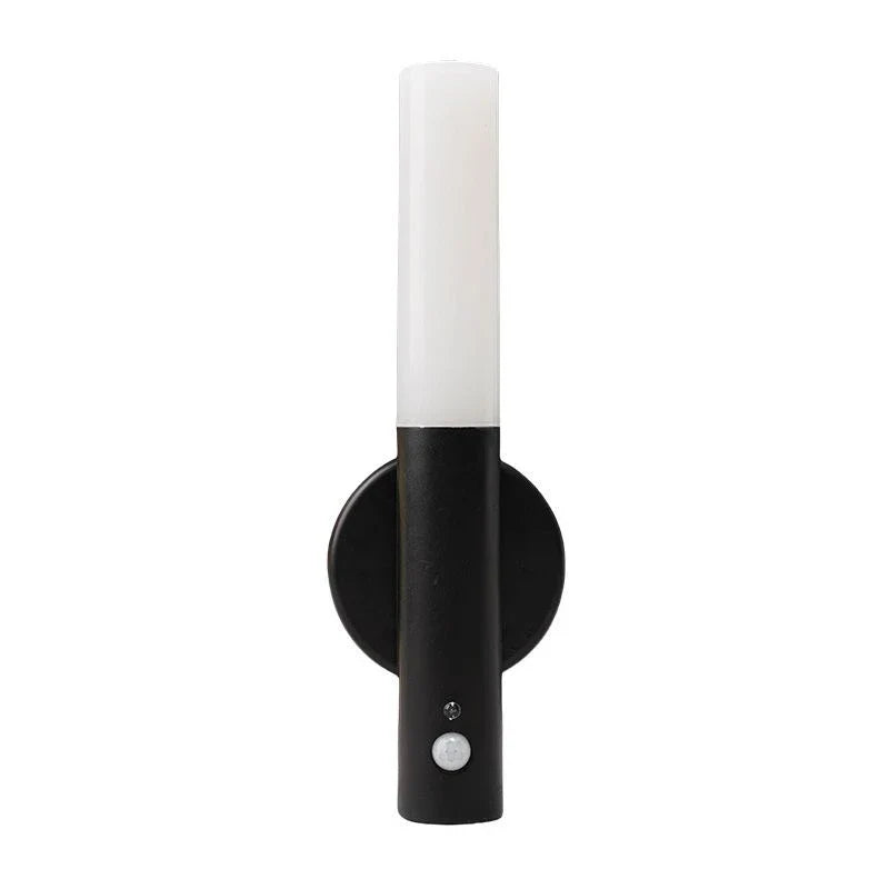 Black and white cylindrical wall light.