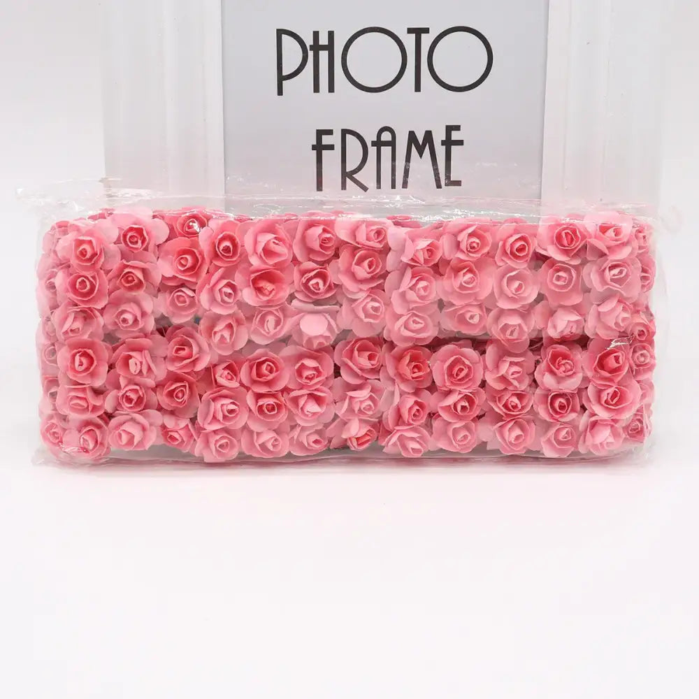 A bundle of delicate pink 144pcs 2cm artificial paper roses neatly arranged for wedding decor or bedroom use by decorbites