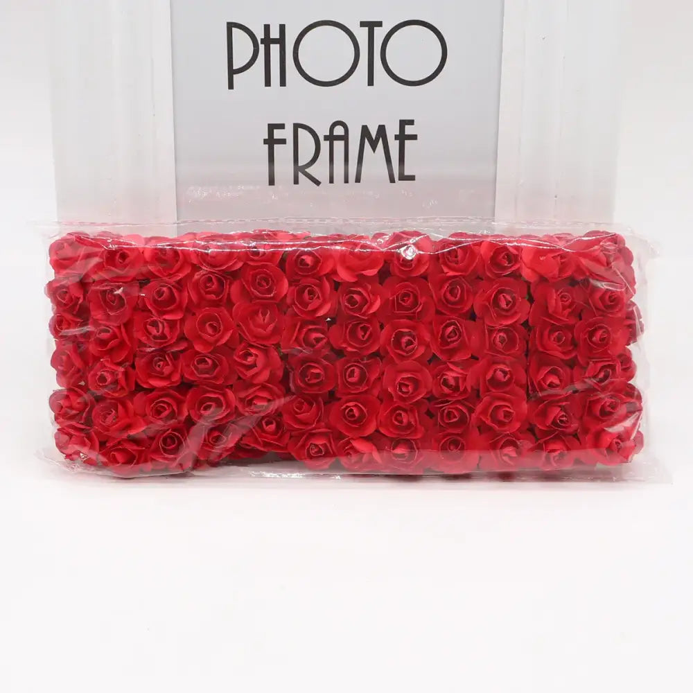 A package of vibrant red decorbites 144pcs 2cm artificial foam roses for wedding and bedroom decor
