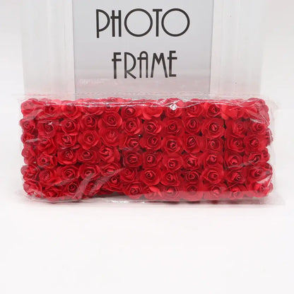 A package of vibrant red decorbites 144pcs 2cm artificial foam roses for wedding and bedroom decor