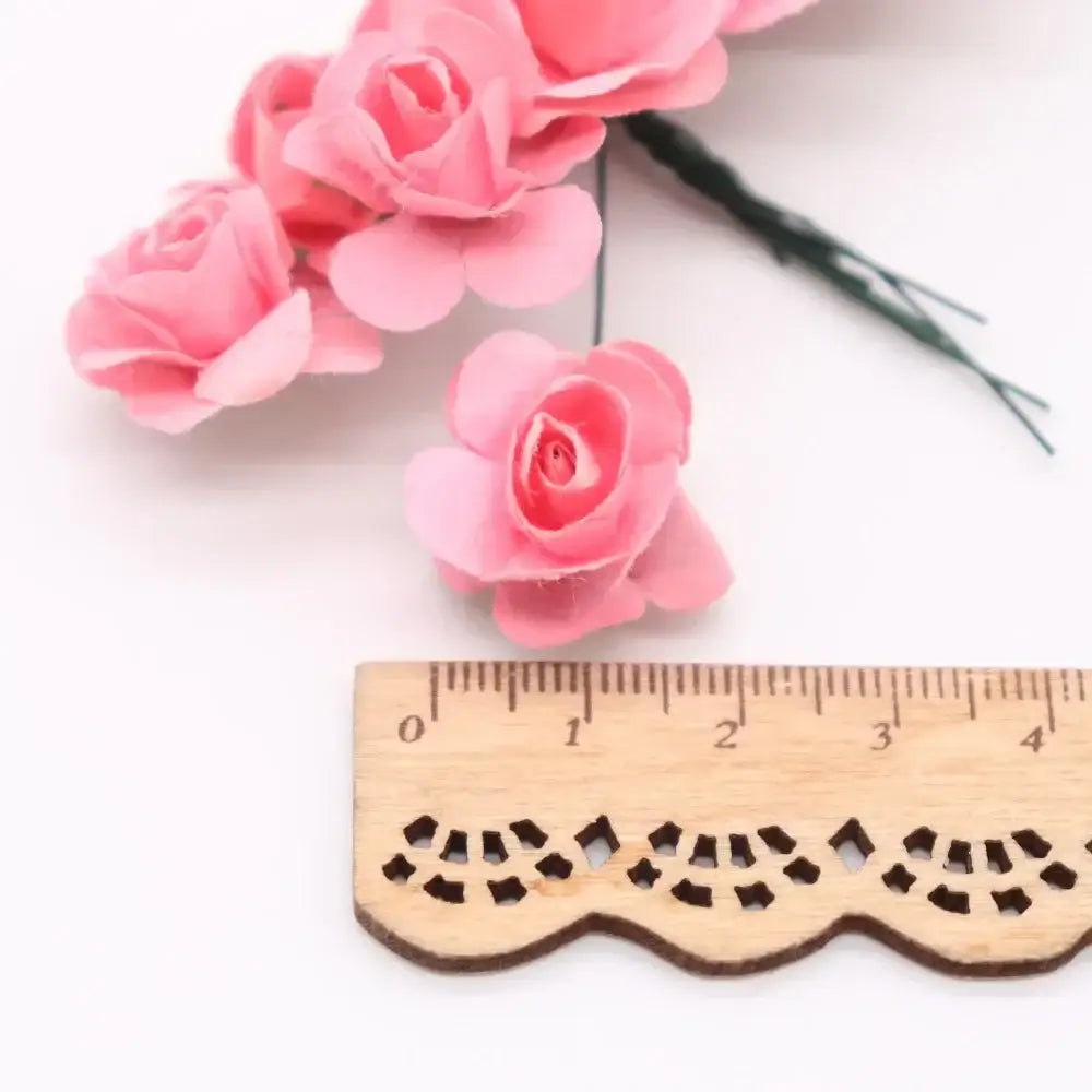 Pink paper roses with delicate layered petals and green wire stems from decorbites 144pcs 2cm artificial paper set