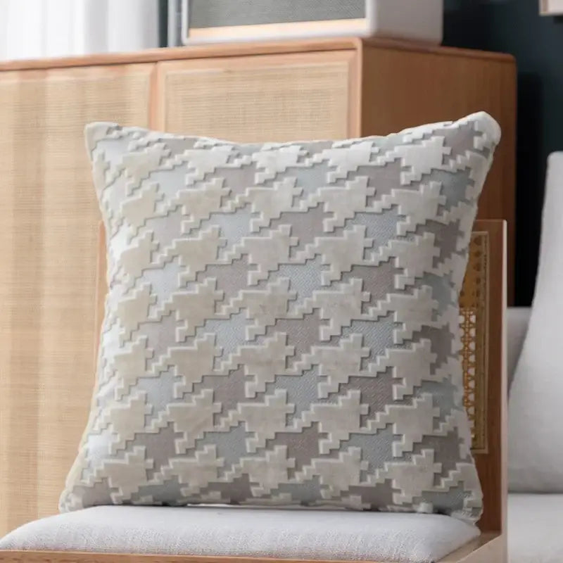 A square pillow cover with a textured gray and off-white houndstooth luxury fabric for decorbites living room decor