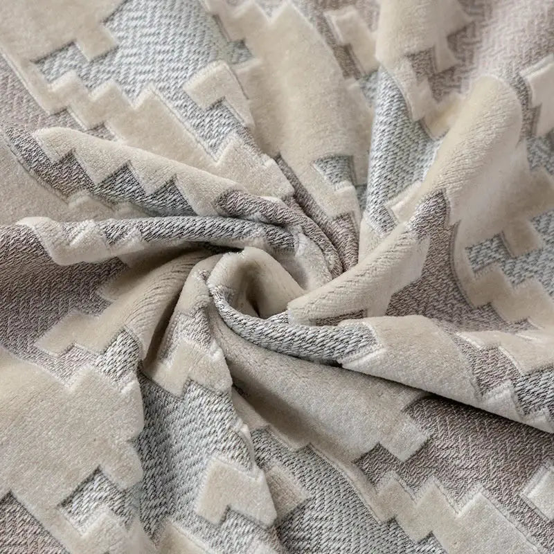 Cream and gray geometric patterned plush throw blanket with soft textured weave complements decorbites houndstooth luxury pillow cover