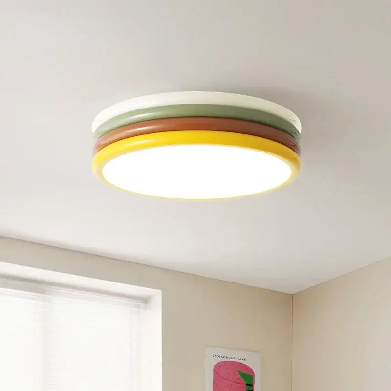 Multi color stack ceiling lamp with concentric rings in white, olive green, terracotta brown, and bright yellow by decorbites
