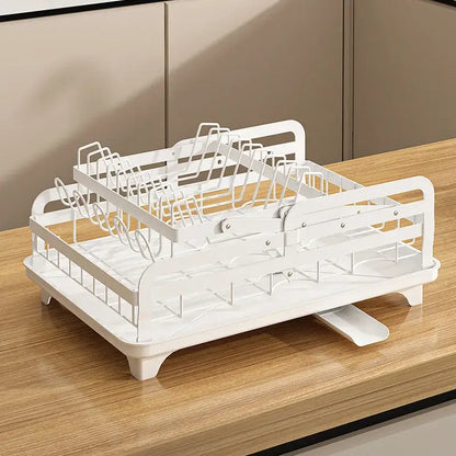 White metal two-tiered dish rack with integrated draining tray used as bowl rack and utensil holder by decorbites kitchen bowl