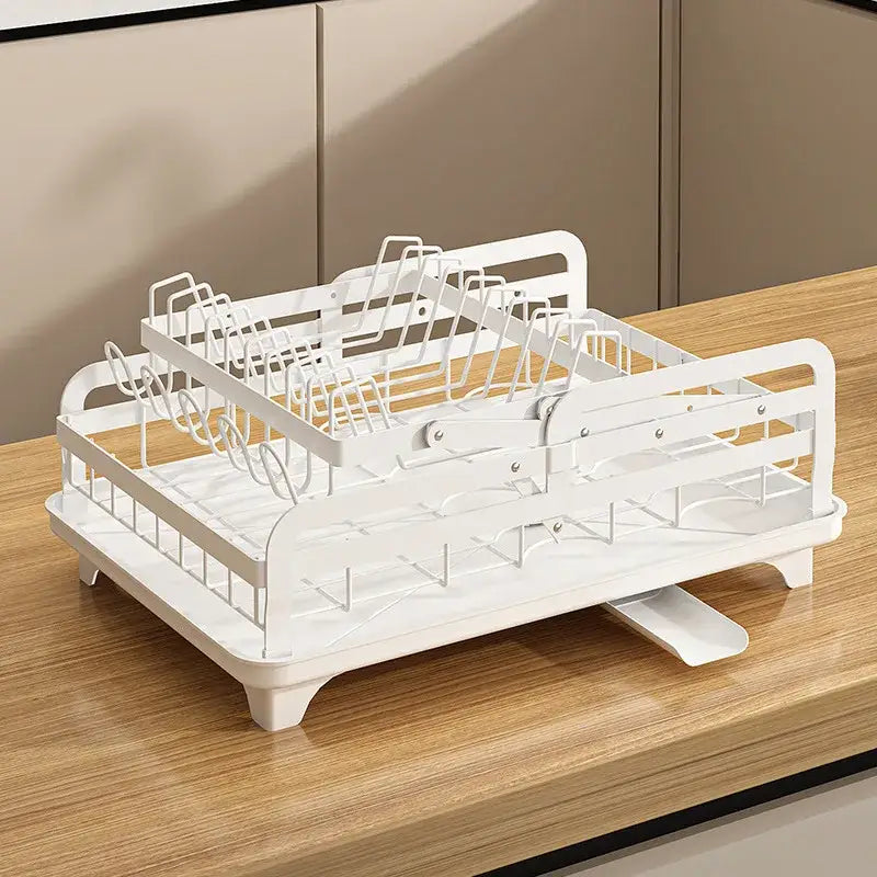 White metal two-tiered dish rack with integrated draining tray used as bowl rack and utensil holder by decorbites kitchen bowl