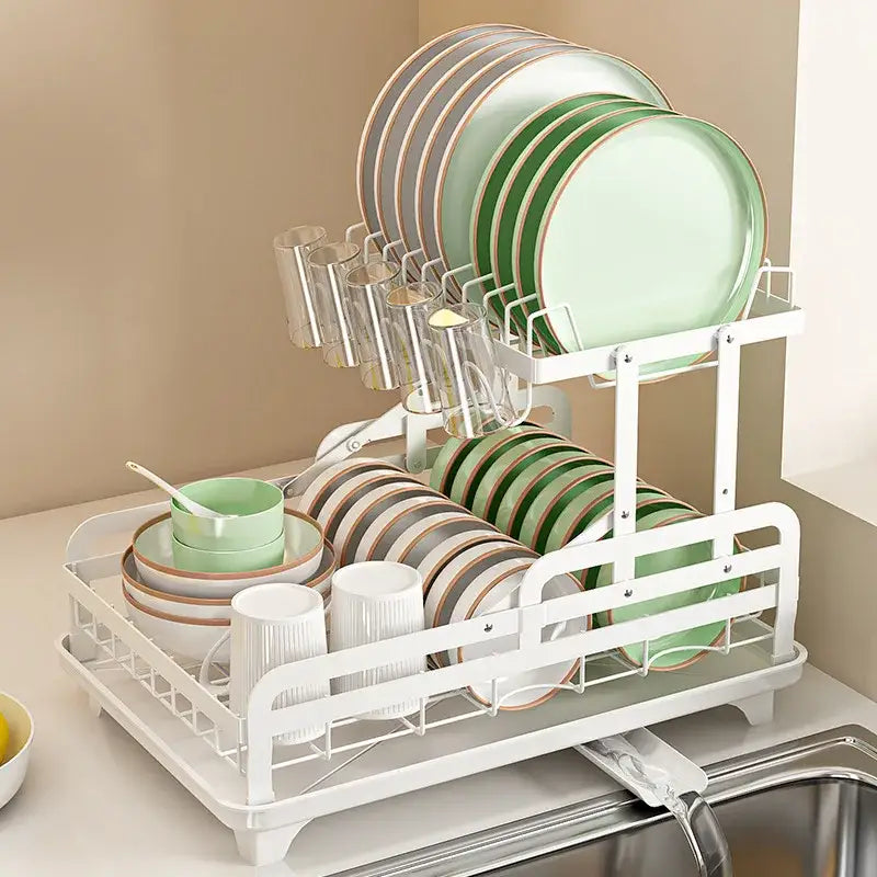 White two-tier metal bowl rack and utensil holder with wire mesh design holding green and beige decorbites kitchen bowls