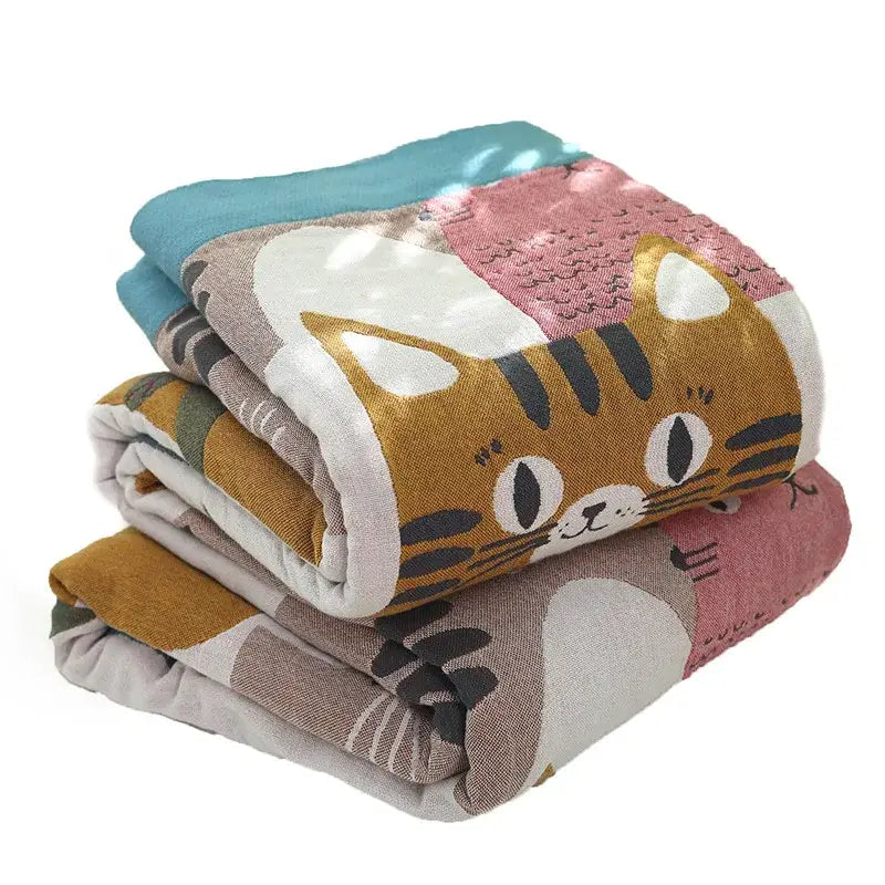 Stack of multicolor boho printed cotton blankets with playful cat design in orange pink and teal for bedroom decorbites throw