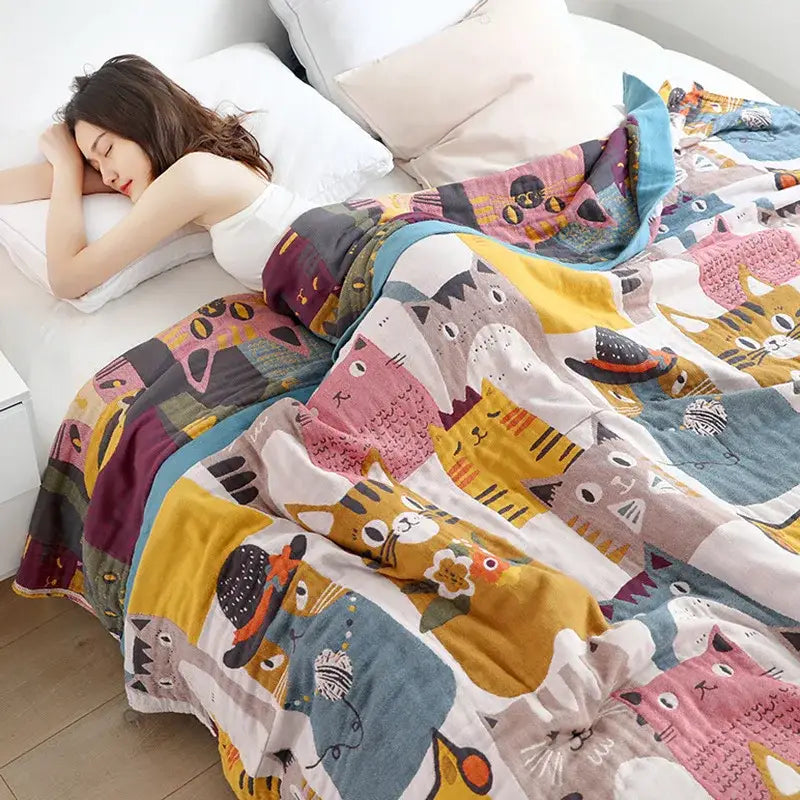 Cozy multicolor boho printed cotton blanket featuring playful cartoon cats in pink yellow gray and blue for bedroom decorbites boho printed