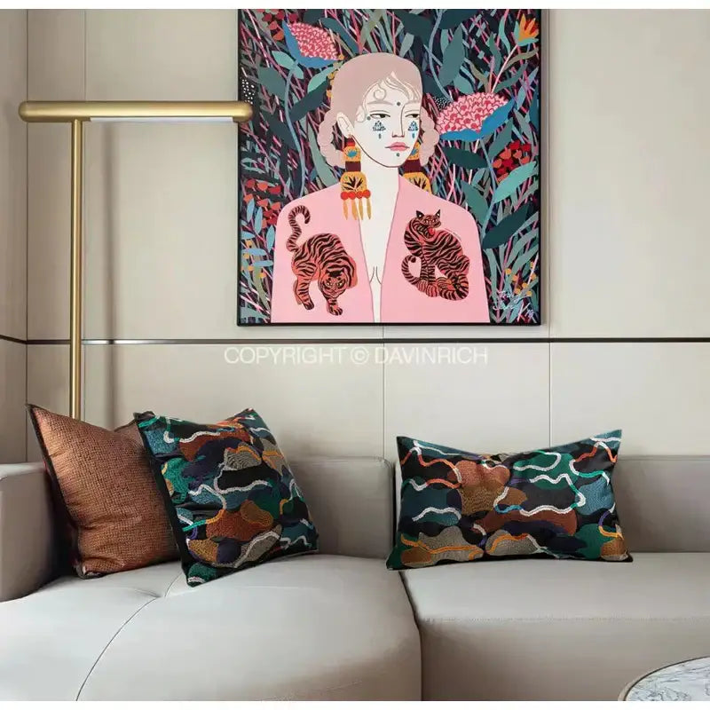Vibrant multicolor geometric embroidery abstract cushion covers featuring a stylized woman in pink with tiger motifs