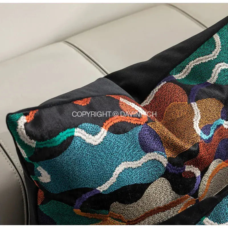 Black velvet cushion cover with vibrant teal orange purple and white decorbites geometric embroidery abstract design