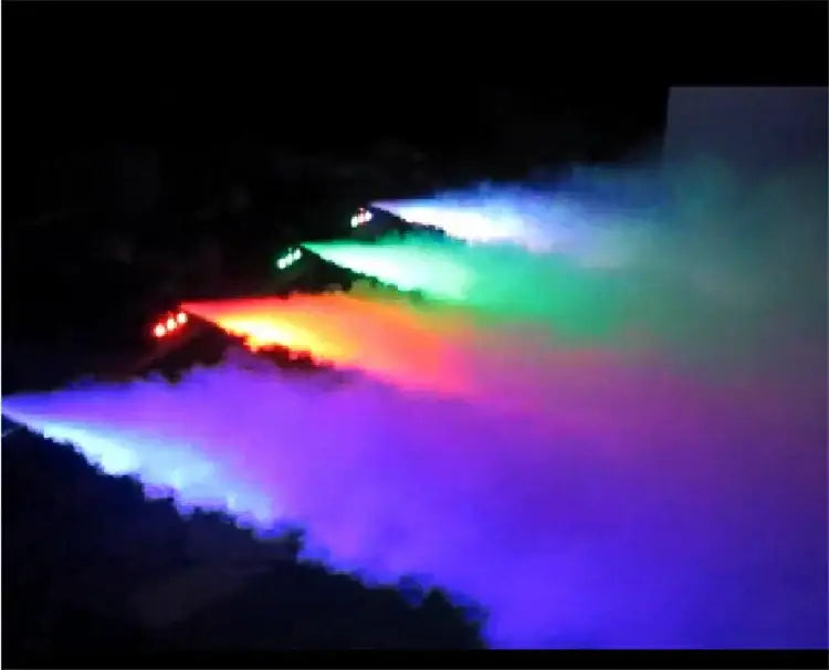 A multicolor led stage smoke machine with remote beams vibrant colored lights through swirling fog for party room stage smoke