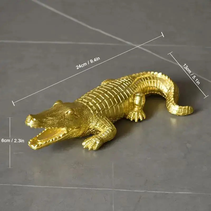 Golden metallic alligator figurine with detailed scales and open mouth in multicolor striped crocodile wildlife sculpture decorbites decor