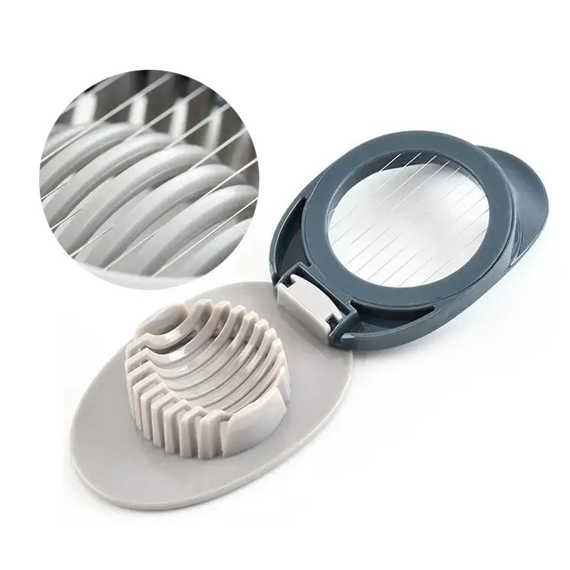 Gray plastic egg cutter with stainless steel circular blade assembly and ridged slots multifunctional kitchen gadget