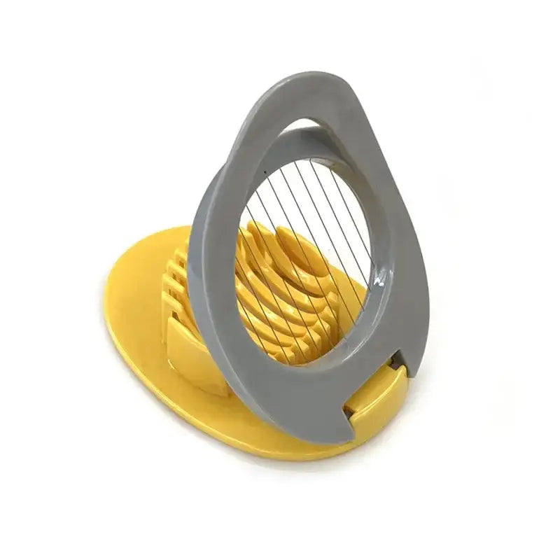 Yellow and gray plastic egg cutter with circular wire grid stainless steel multifunctional kitchen gadget for slicing eggs