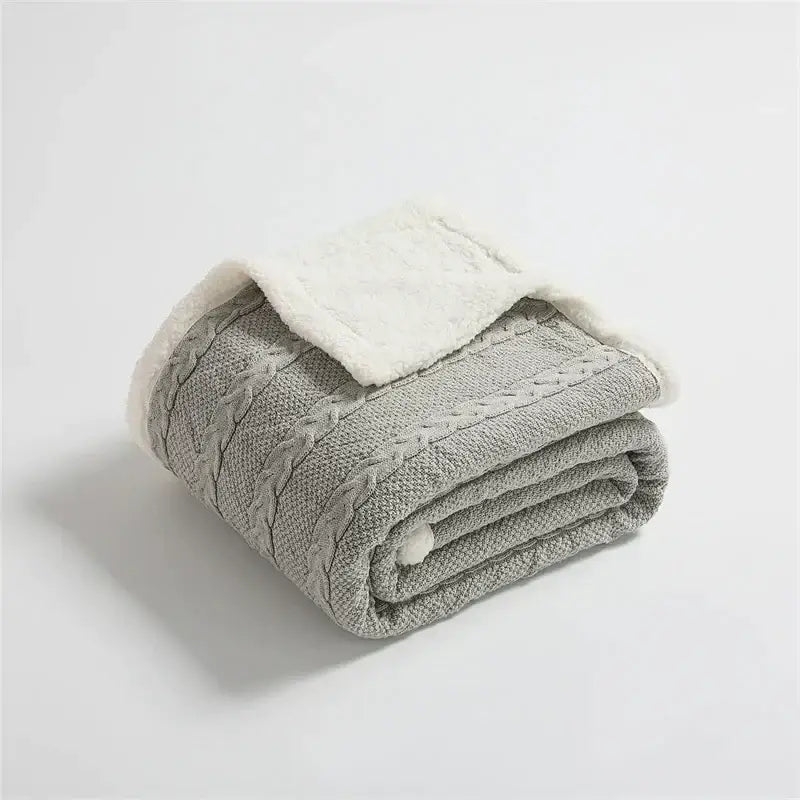 Gray cable knit sherpa blanket with plush white lining by decorbites for cozy bedroom decor and warmth