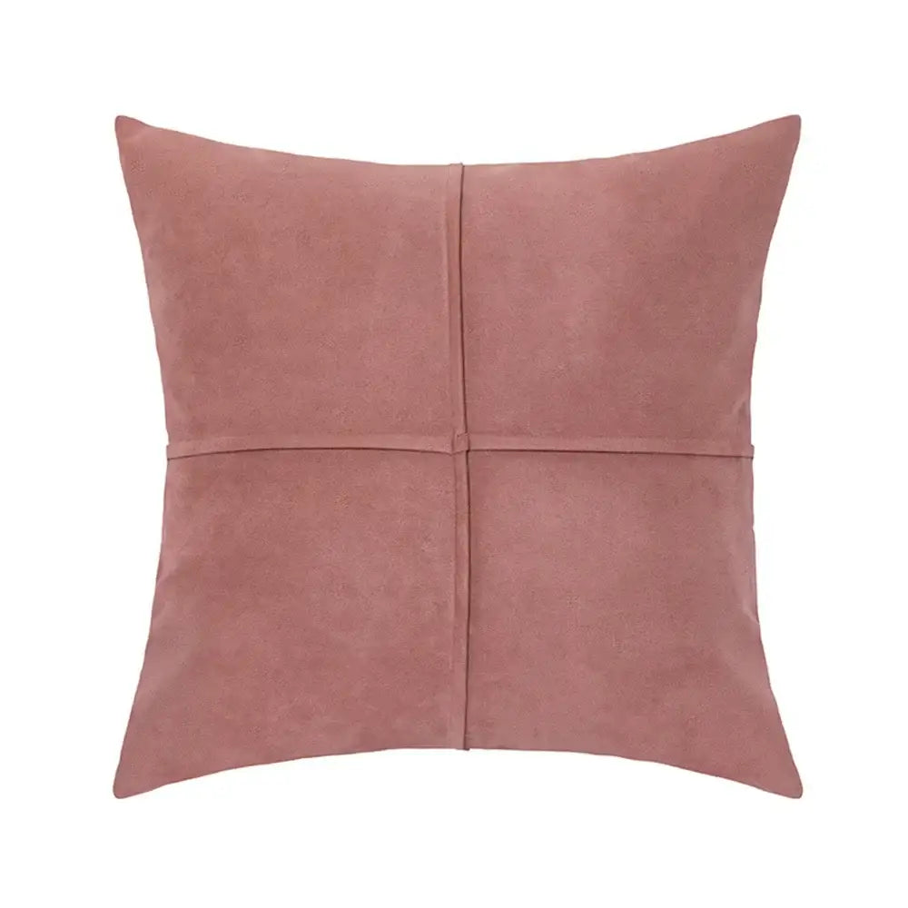 A soft rose-colored cross faux suede pillow cover with subtle cross-stitch design for decorbites living room decor