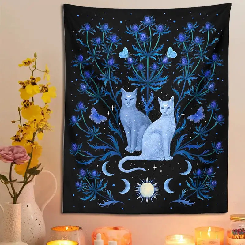 Black decorbites cat tapestry wall hanging with two light blue cats, purple thistle plants, butterflies, and celestial symbols