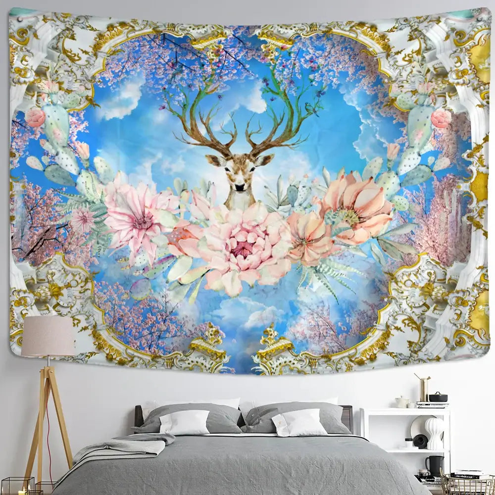 Mystical elk tapestry wall hanging featuring a central deer with pink flowers and cactus against blue sky with gold frame