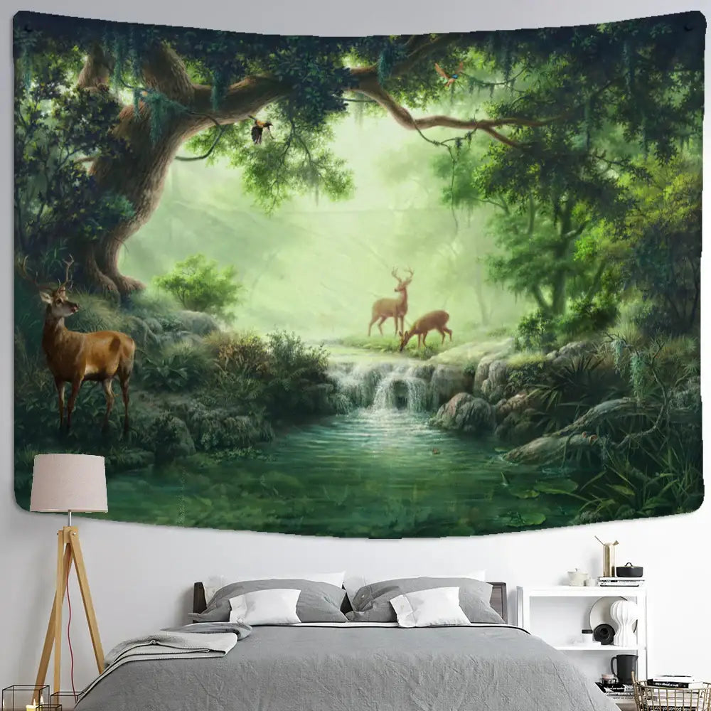 Mystical elk tapestry wall hanging with lush green forest, deer, waterfall, and mossy trees above a bedroom bed