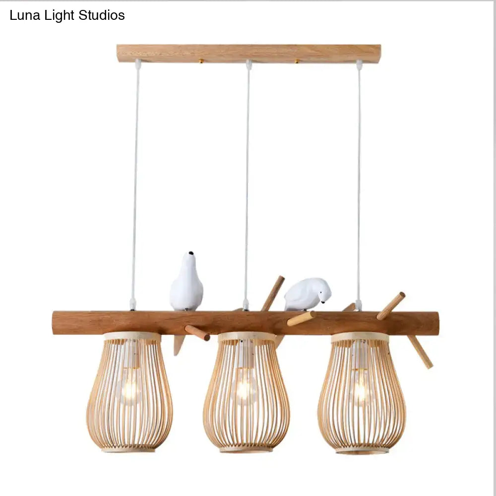 Natural wood and bamboo pendant light with three hanging lanterns and white ceramic birds for dining room island lights