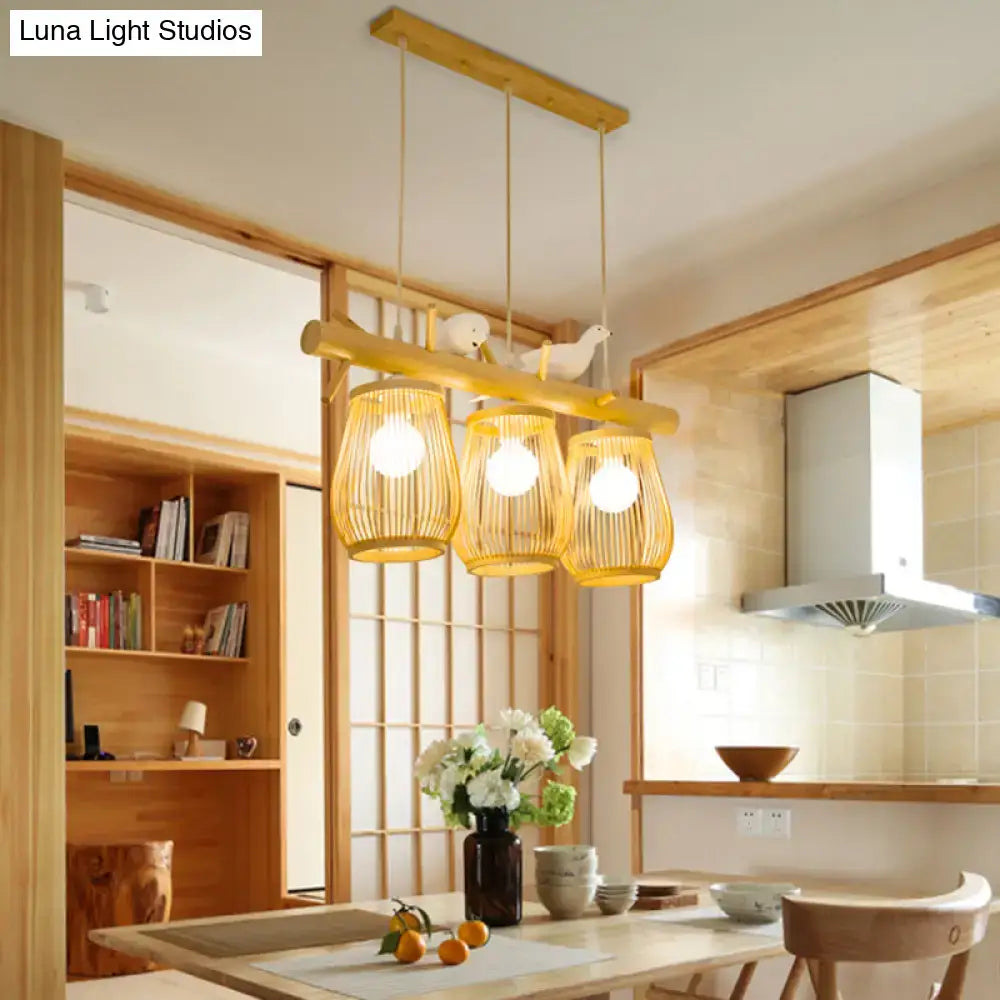 Natural bamboo pendant lights with three woven shades and wooden bar for dining room island lighting