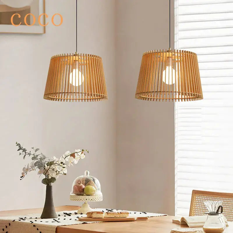 Two warm-toned natural bamboo pendant lamps with slatted cylindrical design decorbites birdcage chandelier pendant